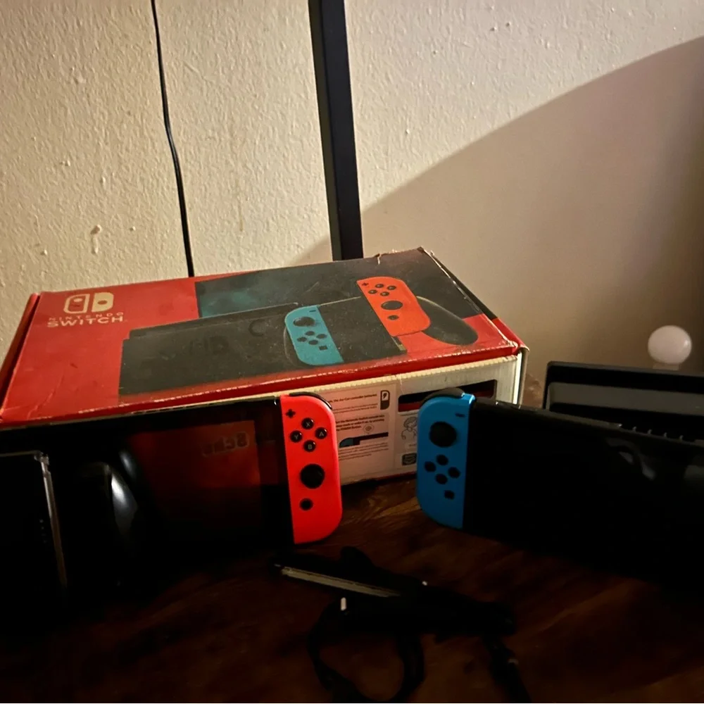 Nintendo Switch Console with Red and Blue Joy-Con Controllers